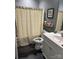 Neutral bathroom with patterned shower curtain, vanity, and decor at 4561 N Wynswept N Dr, Maiden, NC 28650