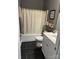 Cozy bathroom featuring a shower-tub combo, dark tile floors, and a white vanity at 4561 N Wynswept N Dr, Maiden, NC 28650