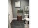 Contemporary bathroom features a toilet, tiled floor, decor, and a large woven basket at 4561 N Wynswept N Dr, Maiden, NC 28650