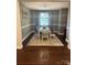 Charming dining room features hardwood floors, modern chandelier, and seating for six guests at 4561 N Wynswept N Dr, Maiden, NC 28650
