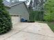 Wide concrete driveway leading to a two-car garage, surrounded by a well-maintained lawn and mature trees at 4561 N Wynswept N Dr, Maiden, NC 28650
