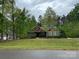 Charming single-story home featuring a landscaped yard, mature trees, and inviting curb appeal at 4561 N Wynswept N Dr, Maiden, NC 28650