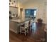 Well-appointed kitchen featuring a granite island, modern appliances, and seating for casual dining at 4561 N Wynswept N Dr, Maiden, NC 28650