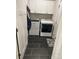 Functional laundry room with modern appliances, white cabinetry, and stylish tile flooring at 4561 N Wynswept N Dr, Maiden, NC 28650