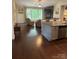 Open-concept living room featuring hardwood floors, a stone fireplace, and ample natural light at 4561 N Wynswept N Dr, Maiden, NC 28650