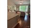 Inviting living room with granite counter, plush sofa, and large windows overlooking a lush green landscape at 4561 N Wynswept N Dr, Maiden, NC 28650