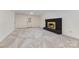 Spacious basement with a brick fireplace, carpeted floors, and access to the backyard at 503 Randa Dr, Statesville, NC 28625