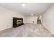 Expansive basement area showcasing a cozy fireplace, carpeted floors, and a staircase to the upper level at 503 Randa Dr, Statesville, NC 28625