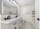 Bathroom featuring a large mirror, a white double vanity, and a modern shower-tub combo at 503 Randa Dr, Statesville, NC 28625