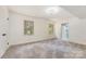 Large bedroom featuring two windows providing natural light and an adjacent bathroom doorway at 503 Randa Dr, Statesville, NC 28625