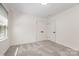 Cozy bedroom boasting soft gray carpet, a bright window, and two practical double door closets at 503 Randa Dr, Statesville, NC 28625