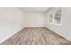 Bright bedroom with wood-look floors and a large window at 503 Randa Dr, Statesville, NC 28625