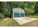 A detached two-car garage with green siding and matching doors provides ample parking and storage space at 503 Randa Dr, Statesville, NC 28625