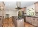 Modern kitchen with stainless appliances, island cooktop and custom range hood at 503 Randa Dr, Statesville, NC 28625
