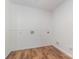 Empty laundry room with wood-look floors and white walls at 503 Randa Dr, Statesville, NC 28625
