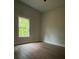 Bedroom with hardwood floors, a neutral color scheme, and a window at 5751 Selkirk Dr, Hickory, NC 28601