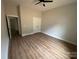 Bedroom with neutral walls and flooring, featuring a closet and white trim at 5751 Selkirk Dr, Hickory, NC 28601