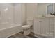 Clean bathroom featuring a white vanity, toilet, and tub and shower combination with vinyl plank flooring at 602 Still St # 1 Blk C, Chester, SC 29706
