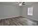Spacious bedroom featuring a ceiling fan, wood-look flooring, and bright natural light at 602 Still St # 1 Blk C, Chester, SC 29706