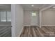 Inviting entryway with natural light, vinyl plank flooring, and modern white trim throughout at 602 Still St # 1 Blk C, Chester, SC 29706