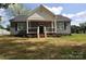 Charming one-story home featuring a cozy front porch and well-manicured lawn at 602 Still St # 1 Blk C, Chester, SC 29706