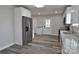 Updated kitchen with stainless steel refrigerator, white cabinets, and granite countertops at 602 Still St # 1 Blk C, Chester, SC 29706