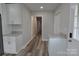 Kitchen space with stainless steel refrigerator, granite countertops and wood look floors at 602 Still St # 1 Blk C, Chester, SC 29706
