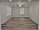 Spacious living room with natural light, ceiling fan, and stylish, modern flooring at 602 Still St # 1 Blk C, Chester, SC 29706