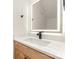 Bathroom with a lighted mirror, modern fixtures, and a granite countertop at 620 Palmer Sw Ave, Concord, NC 28027