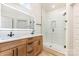 Bright bathroom with double sinks, granite countertops, glass enclosed shower, and modern fixtures at 620 Palmer Sw Ave, Concord, NC 28027