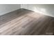 Bedroom featuring bright natural light and neutral colored hardwood style flooring at 631 S Elm St, Statesville, NC 28677
