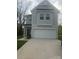 Charming two-story home featuring a large two car garage and a well-manicured front lawn at 631 S Elm St, Statesville, NC 28677