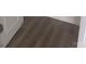 Close up of installed hardwood style flooring at 631 S Elm St, Statesville, NC 28677
