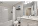 Bathroom with a shower-tub combo, sink, and ornate shelving at 6842 Berewick Commons Pkwy, Charlotte, NC 28278
