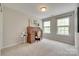 Bright bedroom with a rolltop desk near two windows at 6842 Berewick Commons Pkwy, Charlotte, NC 28278