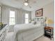 Bedroom featuring a queen bed, two windows, two bedside tables, and contemporary decor at 6842 Berewick Commons Pkwy, Charlotte, NC 28278
