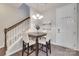 Cozy dining area featuring a modern chandelier and staircase in a brightly lit home at 6842 Berewick Commons Pkwy, Charlotte, NC 28278