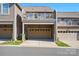 Exterior view of a townhouse featuring a garage and upper deck, offering modern living at 6842 Berewick Commons Pkwy, Charlotte, NC 28278