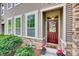Inviting front entrance with a charming wreath and colorful flower pots at 6842 Berewick Commons Pkwy, Charlotte, NC 28278