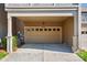 Attached garage with painted door, green shrubbery and green lawn space at 6842 Berewick Commons Pkwy, Charlotte, NC 28278