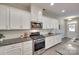 Modern kitchen with granite countertops, stainless steel appliances, and ample cabinet space at 6842 Berewick Commons Pkwy, Charlotte, NC 28278