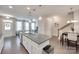 Open floor plan features kitchen island, dining area, and staircase at 6842 Berewick Commons Pkwy, Charlotte, NC 28278
