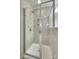 A shower features clear glass doors and neutral tiling at 6842 Berewick Commons Pkwy, Charlotte, NC 28278