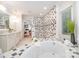 Bright bathroom featuring walk-in shower, garden tub, dual sinks, and tile accents at 6868 St Peters Ln, Matthews, NC 28105