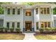 Inviting front entrance with a stained wood door and windowed sidelights, plus cozy seating at 6868 St Peters Ln, Matthews, NC 28105
