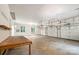 Spacious garage with multiple bays, high ceilings, and work bench at 6868 St Peters Ln, Matthews, NC 28105