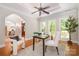 Cozy home office with hardwood floors, natural light, and custom ceiling details at 6868 St Peters Ln, Matthews, NC 28105