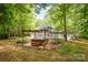 A relaxing hot tub sits within a well-landscaped backyard at 6868 St Peters Ln, Matthews, NC 28105