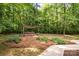 Backyard hot tub and patio provide a relaxing outdoor space at 6868 St Peters Ln, Matthews, NC 28105