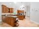 Spacious kitchen featuring tile floors, high ceilings, and abundant countertop space at 6868 St Peters Ln, Matthews, NC 28105